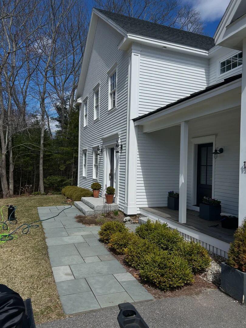 Backyard and exterior of a home with service work in progress